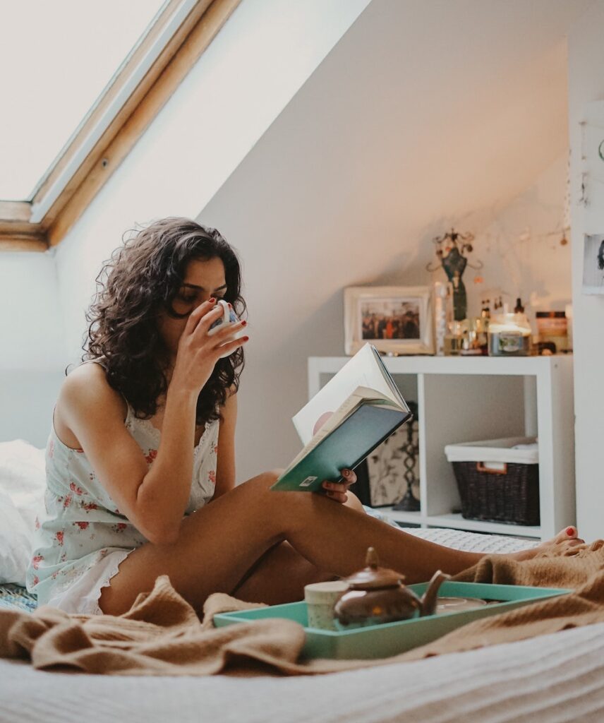 woman-drinking-tea-reading-book-self-love-love-yourself