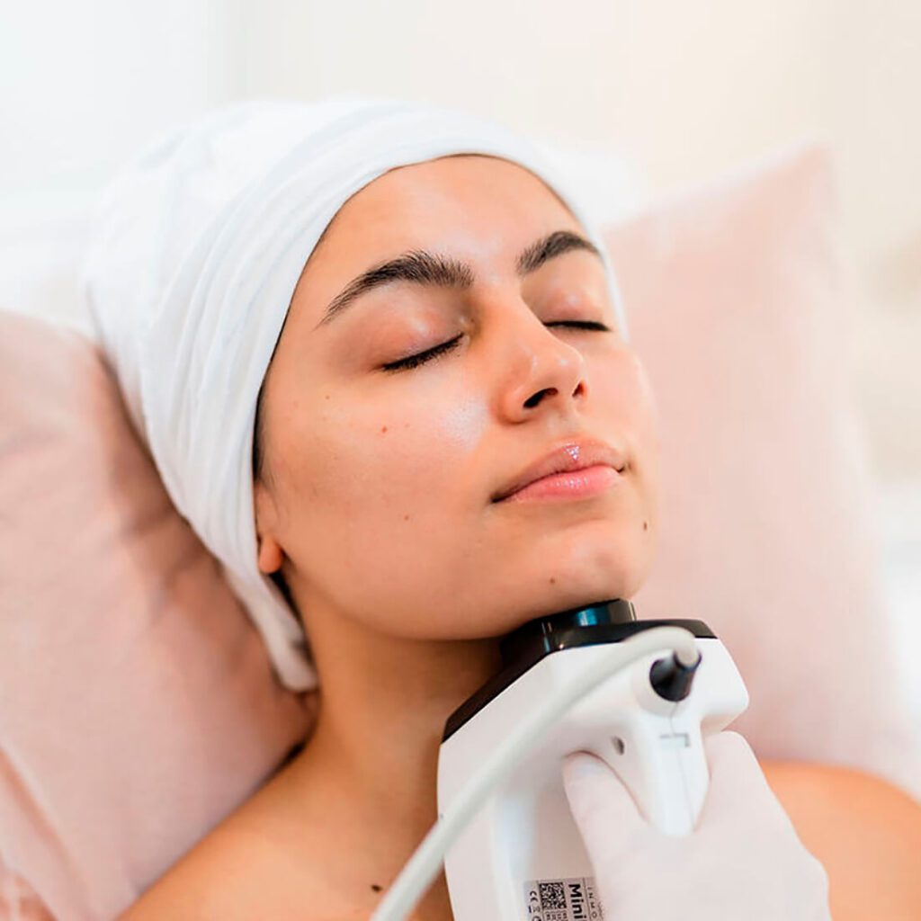 Woman receiving the InMode Contoura Facial treatment at Facial Sculpting Clinic by Dr Nina in London, using non-invasive radiofrequency technology to lift and tighten the lower face