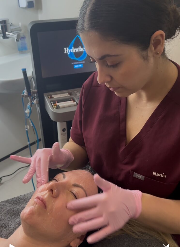 Senior Aesthetician and Skincare Specialist Nadia Aminian performing the Signature Ultimate Revive Facial at The Taktouk Clinic in London, using advanced skincare techniques for a radiant and rejuvenated complexion